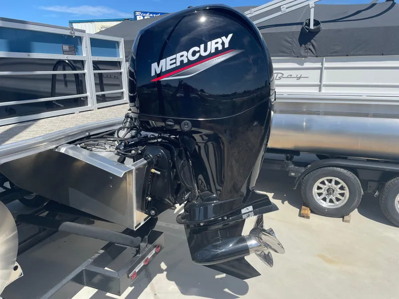 Slide: The Image of 2025 South Bay 224FCRLE with Mercury outboard motor on trailer. - 3