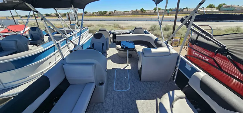 Slide: The Image of 2025 South Bay 224FCRLE pontoon boat interior with spacious seating and modern design. - 5