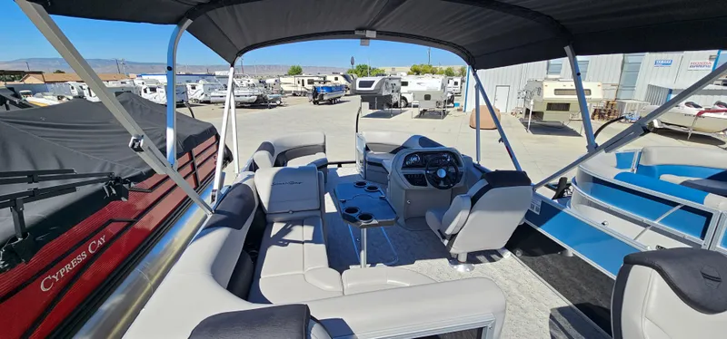 Slide: The Image of 2025 South Bay 224FCRLE pontoon boat interior with seating and helm station. - 6