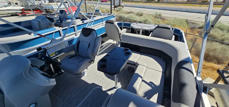 Slide: The Image of 2025 South Bay 224FCRLE pontoon boat interior with seating and helm. - 7