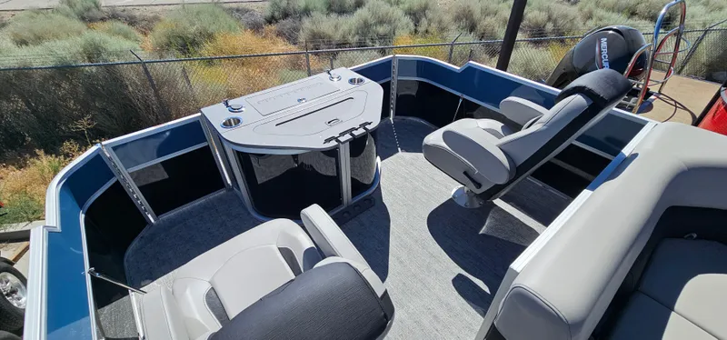 Slide: The Image of 2025 South Bay 224FCRLE pontoon boat interior with seating and control console. - 9