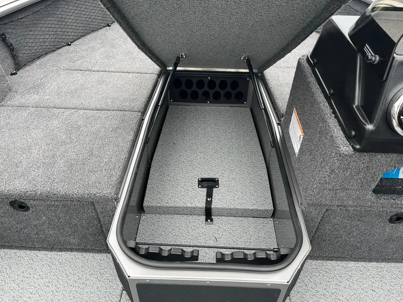 Slide: The Image of 2025 Lund 1875 Impact XS SS boat with open storage compartment. - 13