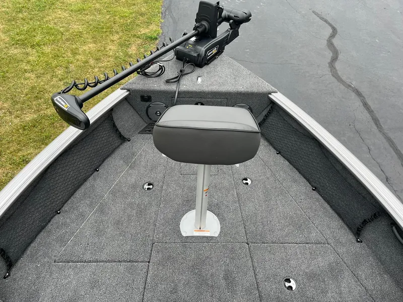 Slide: The Image of 2025 Lund 1875 Impact XS SS boat deck with seat and trolling motor. - 14