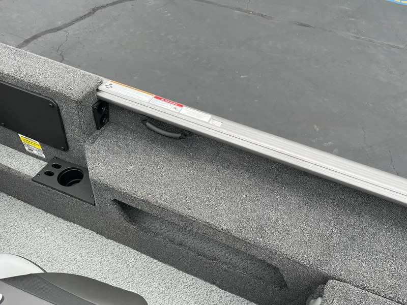 Slide: The Image of 2025 Lund 1875 Impact XS SS boat interior with textured surface and cup holder. - 24