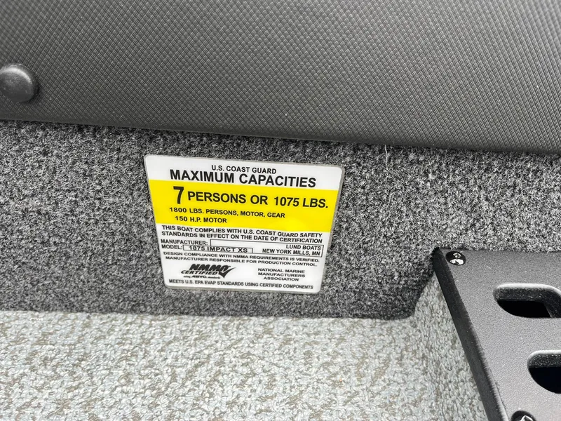 Slide: The Image of Capacity label on 2025 Lund 1875 Impact XS SS boat: 7 persons or 1075 lbs. - 30