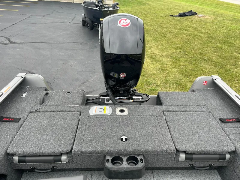 Slide: The Image of 2025 Lund 1875 Impact XS SS boat with outboard motor, rear view. - 9