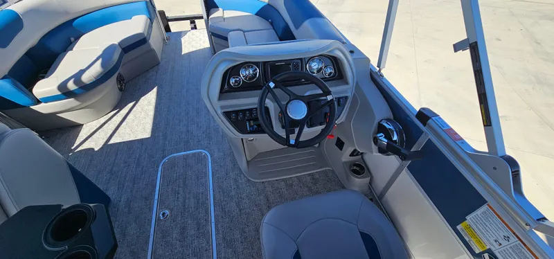 Slide: The Image of 2025 South Bay 224FCRLE boat interior with steering console and seating - 14