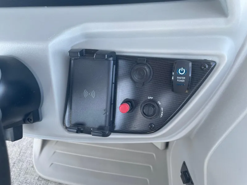 Slide: The Image of Control panel of 2025 South Bay 224FCRLE with power switch and charging dock. - 17