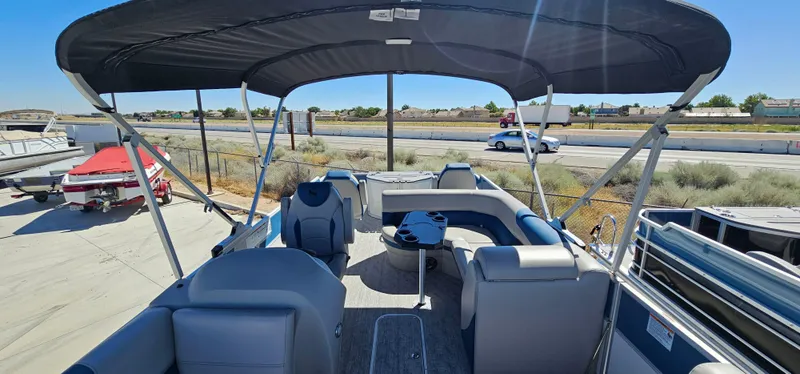 Slide: The Image of 2025 South Bay 224FCRLE pontoon boat with spacious seating and canopy. - 2