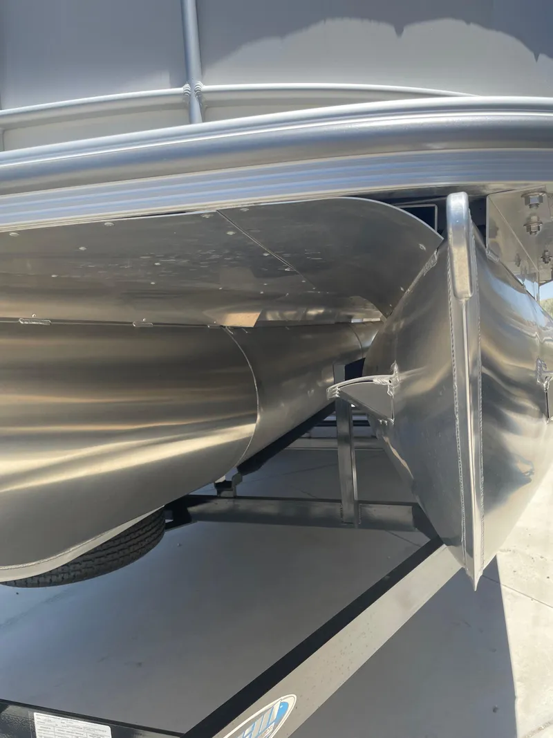 Slide: The Image of Underneath view of 2025 South Bay 224FCRLE pontoon boat, showcasing sleek aluminum construction. - 22