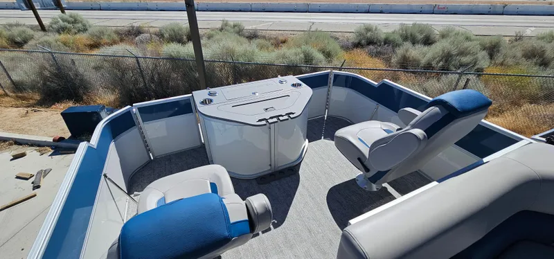 Slide: The Image of 2025 South Bay 224FCRLE pontoon boat interior with seating and control console. - 6