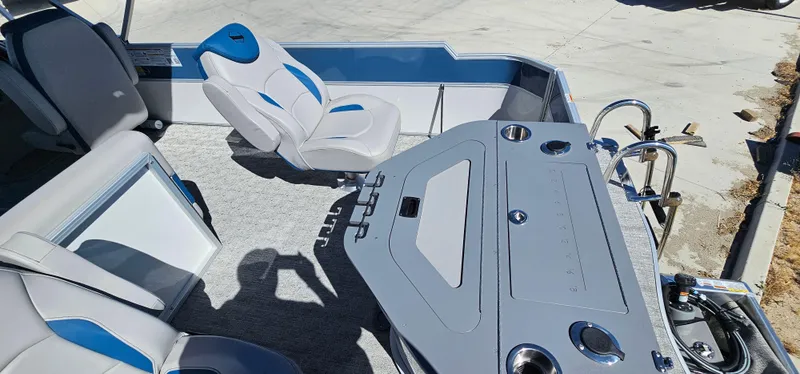 Slide: The Image of 2025 South Bay 224FCRLE boat interior with seating and control panel. - 7