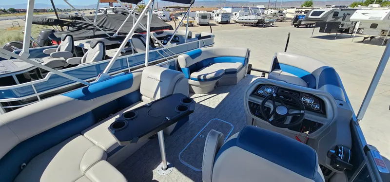 Slide: The Image of 2025 South Bay 224FCRLE pontoon boat interior with seating and control console. - 9