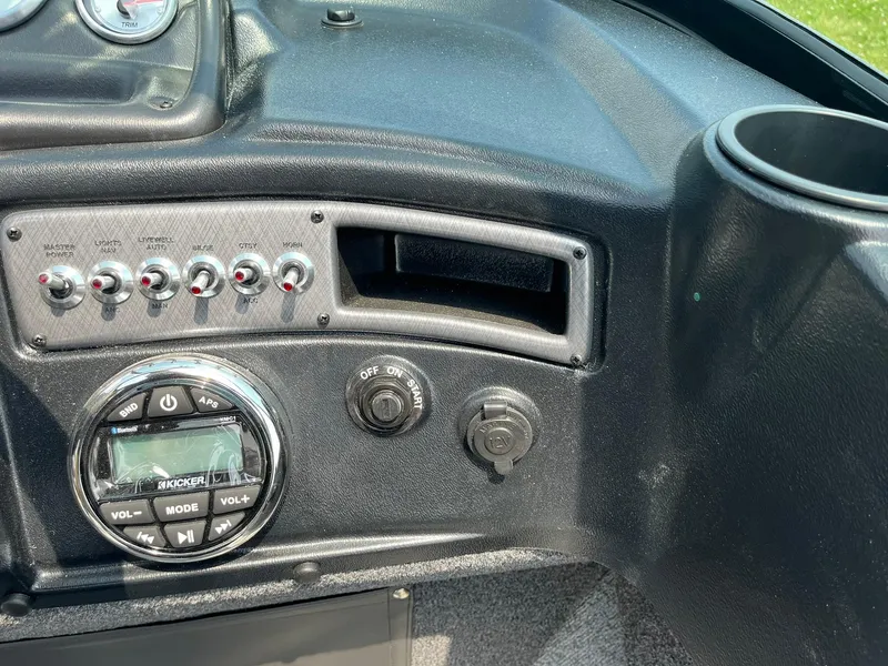 Slide: The Image of Control panel of 2025 Lund 2075 Fisherman boat with switches and stereo system. - 24