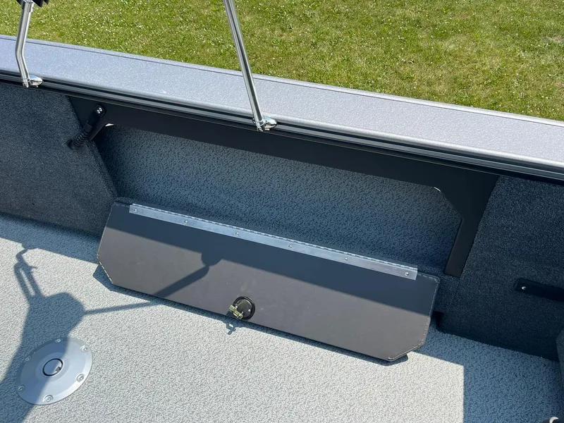 Slide: The Image of 2025 Lund 2075 Fisherman boat interior with storage compartment and rod holder. - 26