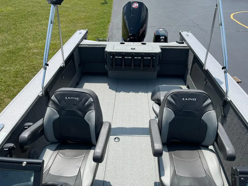 Slide: The Image of 2025 Lund 2075 Fisherman boat interior with two seats and motor. - 7