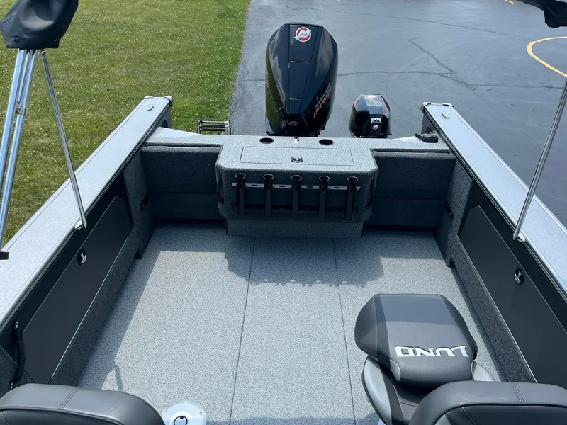 Slide: The Image of 2025 Lund 2075 Fisherman boat interior with motor and seating. - 8