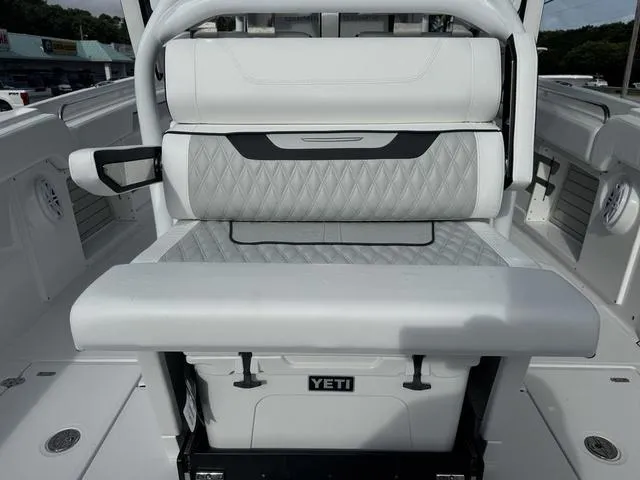 Slide: The Image of 2024 Blackfin 302CC boat interior seating with modern design and comfortable upholstery. - 13