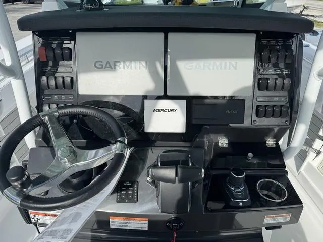 Slide: The Image of Showroom filled with various motorcycles, ATVs, and off-road vehicles. - 21