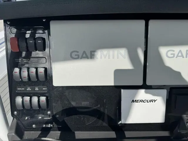 Slide: The Image of 2024 Blackfin 302CC boats on trailers at a dealership under a blue sky. - 25