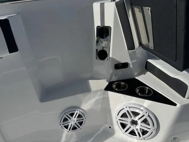 Slide: The Image of Outdoor dealership with jet skis, ATVs, and boats, featuring Blackfin 302CC, 2024 model. - 27