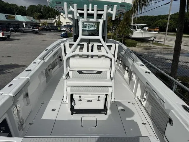 Slide: The Image of 2024 Blackfin 302CC boat deck with dual outboard motors. - 4