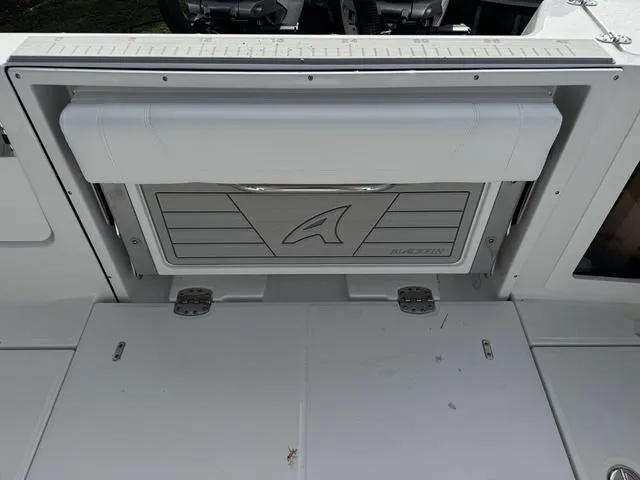 Slide: The Image of 2024 Blackfin 302CC boat cockpit with dual seating and advanced navigation system. - 8