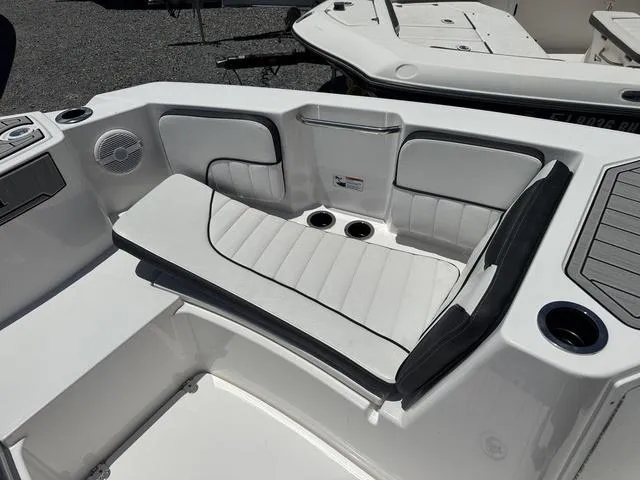 Slide: The Image of 2024 Yamaha Boats 222 FSH Sport dashboard with steering wheel and controls. - 11