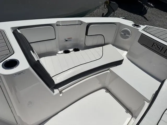 Slide: The Image of 2024 Yamaha Boats 222 FSH Sport seating, featuring beige and brown cushioned design. - 12