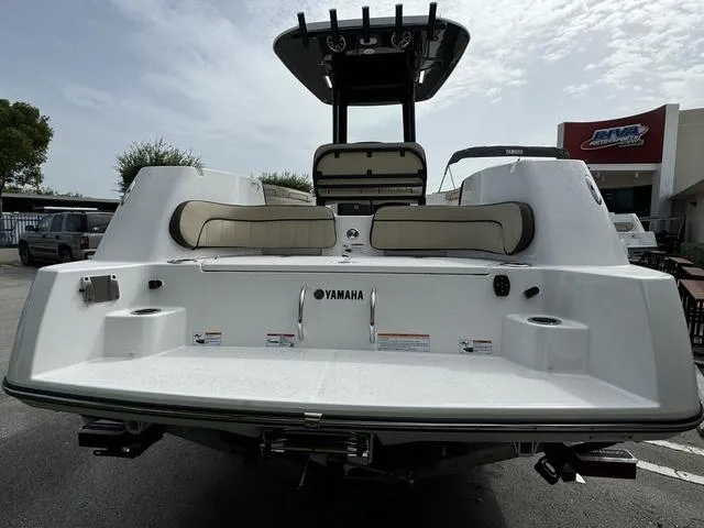 Slide: The Image of 2024 Yamaha Boats 255 FSH Sport E, rear view at dealership. - 3