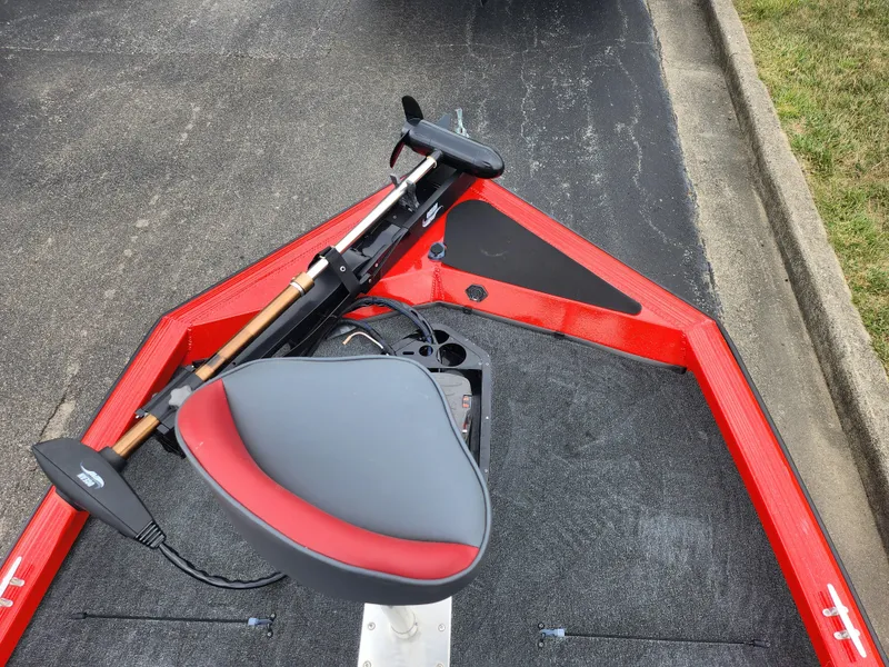 Slide: The Image of 2021 Caravelle Raptor 180 Bass boat with red and black interior. - 17