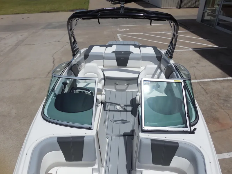 Slide: The Image of 2024 Chaparral 21 SSi boat interior with open windshield and seating. - 10