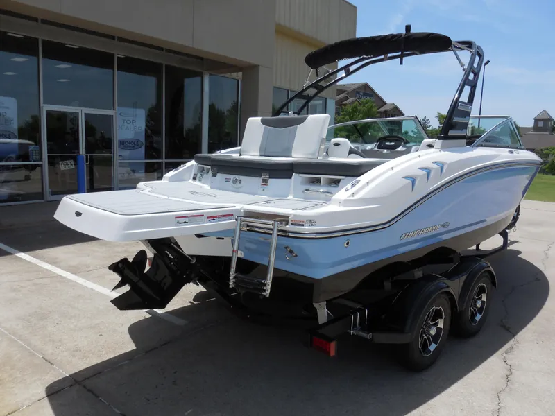Slide: The Image of 2024 Chaparral 21 SSi boat on a trailer outside a dealership. - 3