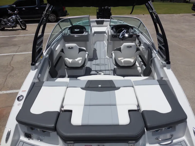 Slide: The Image of 2024 Chaparral 21 SSi boat interior with white and gray seating. - 6