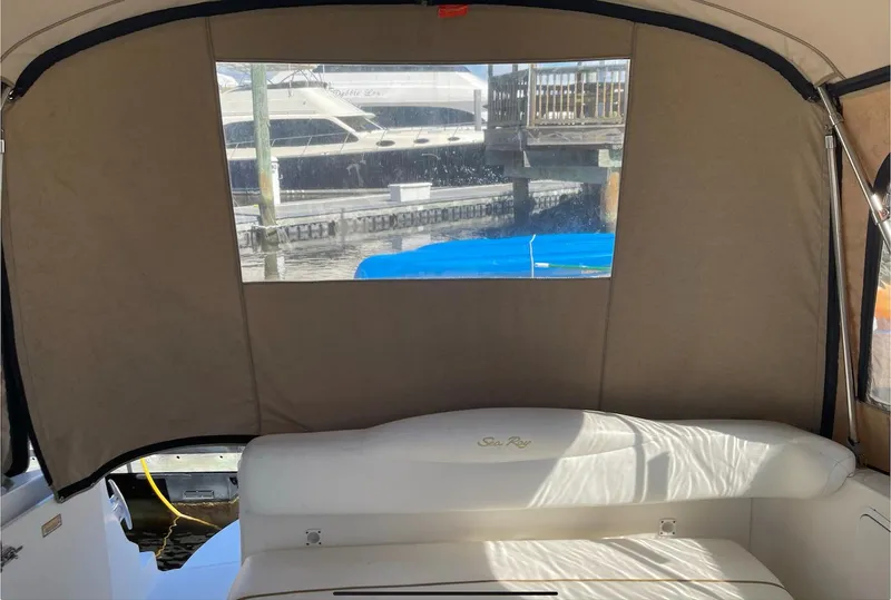 Slide: The Image of Interior view of 2002 Sea Ray 280 Sundancer boat with rear canvas cover. - 11