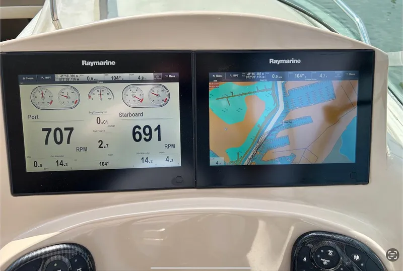 Slide: The Image of Raymarine navigation and engine display on a 2002 Sea Ray 280 Sundancer boat. - 20
