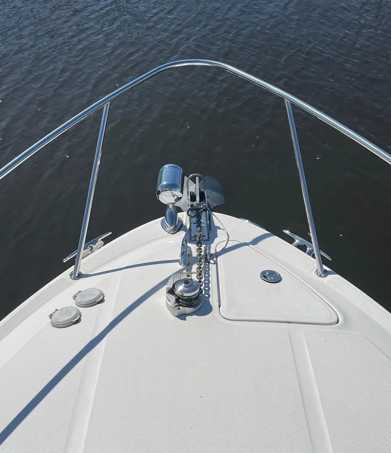 Slide: The Image of Bow of 2002 Sea Ray 280 Sundancer on calm water. - 8