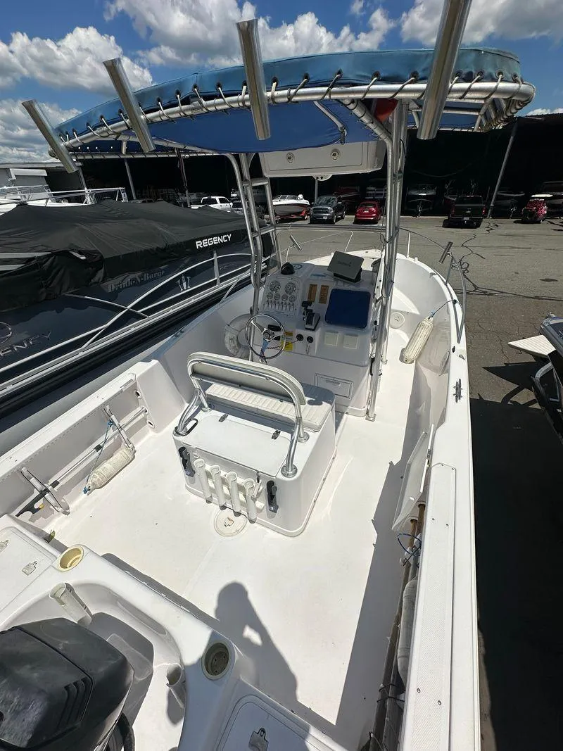 Slide: The Image of 2002 Pro-Line 20 Sport boat with center console and blue canopy. - 11