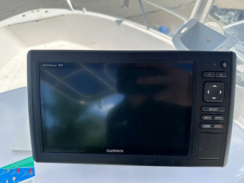 Slide: The Image of Garmin echomap SV on 2002 Pro-Line 20 Sport boat dashboard. - 14