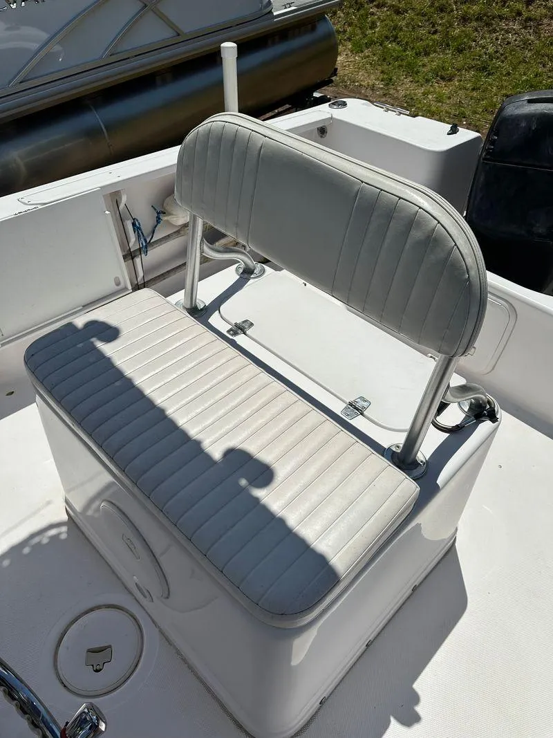 Slide: The Image of 2002 Pro-Line 20 Sport boat with white cushioned seating. - 17