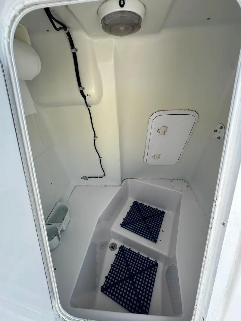 Slide: The Image of 2002 Pro-Line 20 Sport boat interior storage compartment. - 22