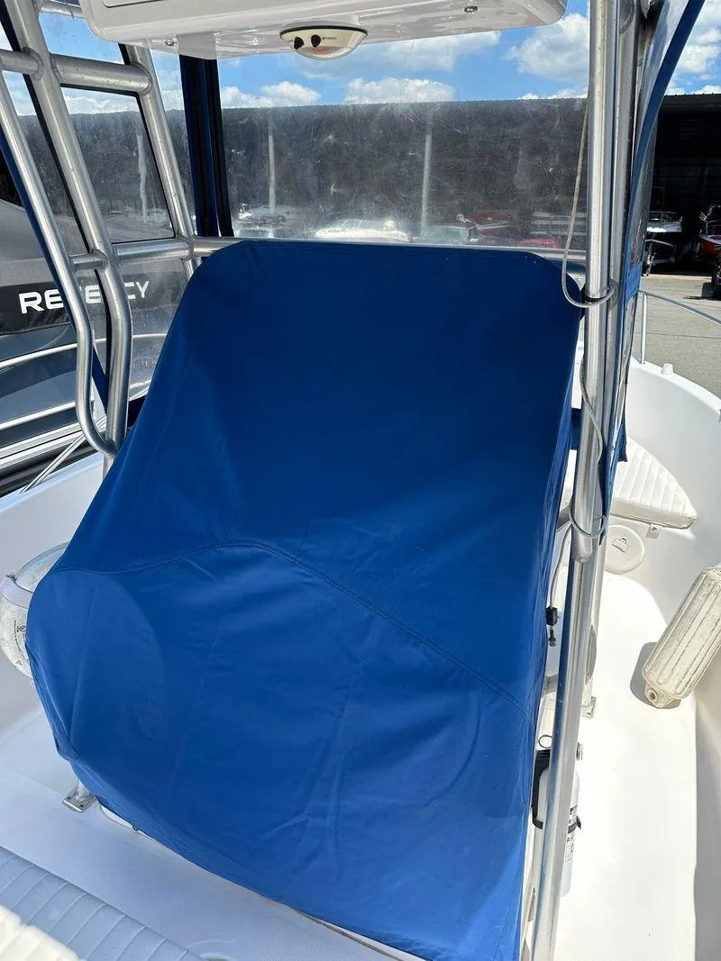 Slide: The Image of 2002 Pro-Line 20 Sport boat with blue seat cover and stainless steel frame. - 24
