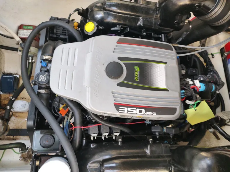 Slide: The Image of 2015 Sea Ray 260 Sundancer engine compartment with 350 MAG engine. - 18