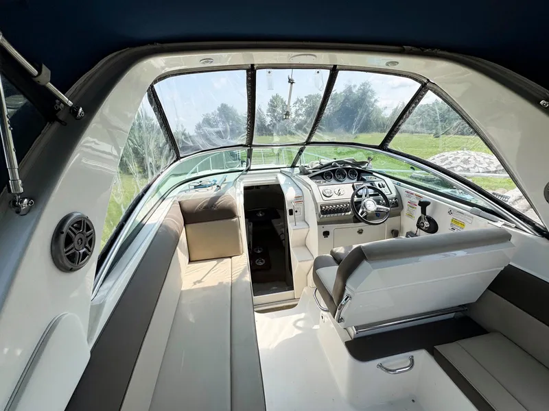 Slide: The Image of Interior of 2015 Sea Ray 260 Sundancer boat with helm and seating area. - 5