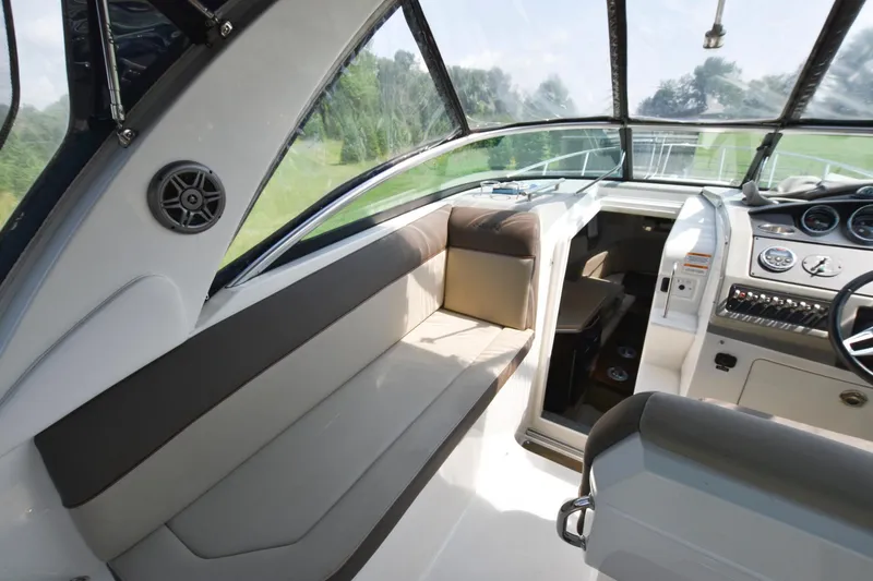 Slide: The Image of Interior of 2015 Sea Ray 260 Sundancer boat with seating and helm station. - 8