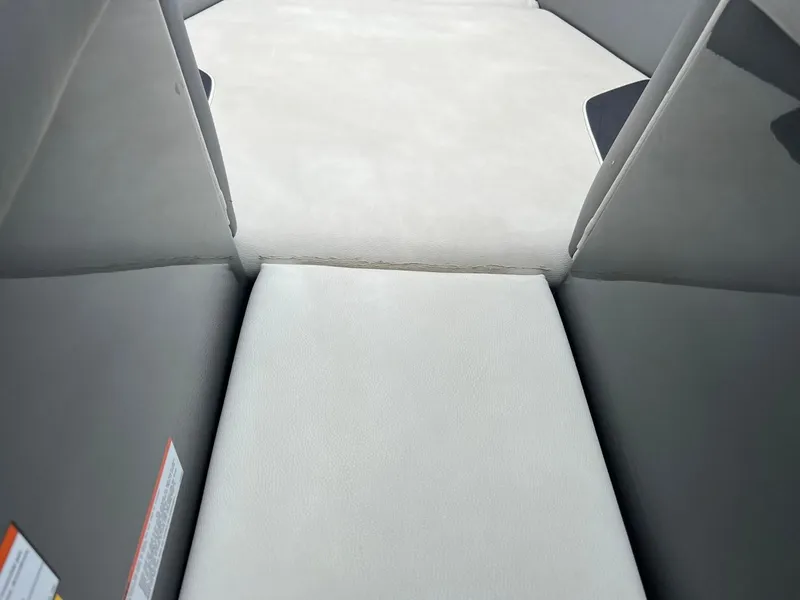 Slide: The Image of Interior seating of 2017 Tigé R21 boat with gray and white upholstery. - 11