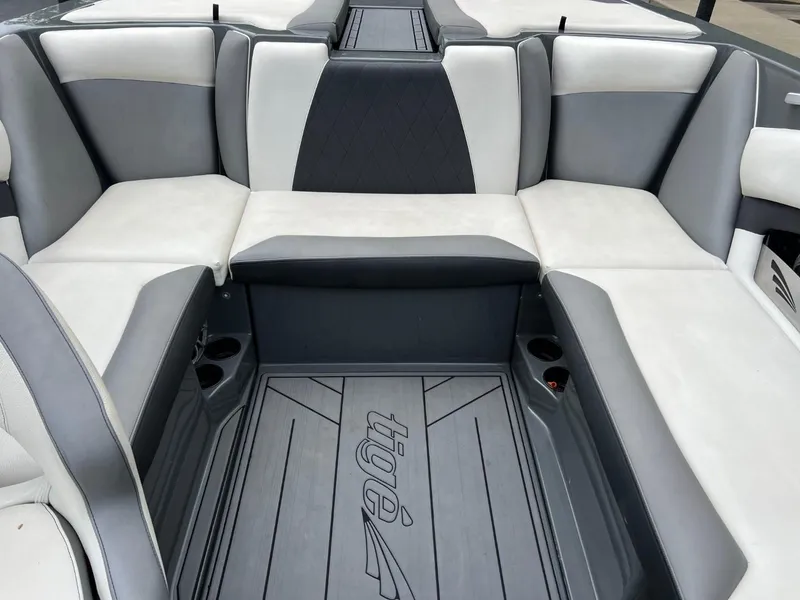 Slide: The Image of 2017 Tigé R21 boat interior with gray and white seating. - 13