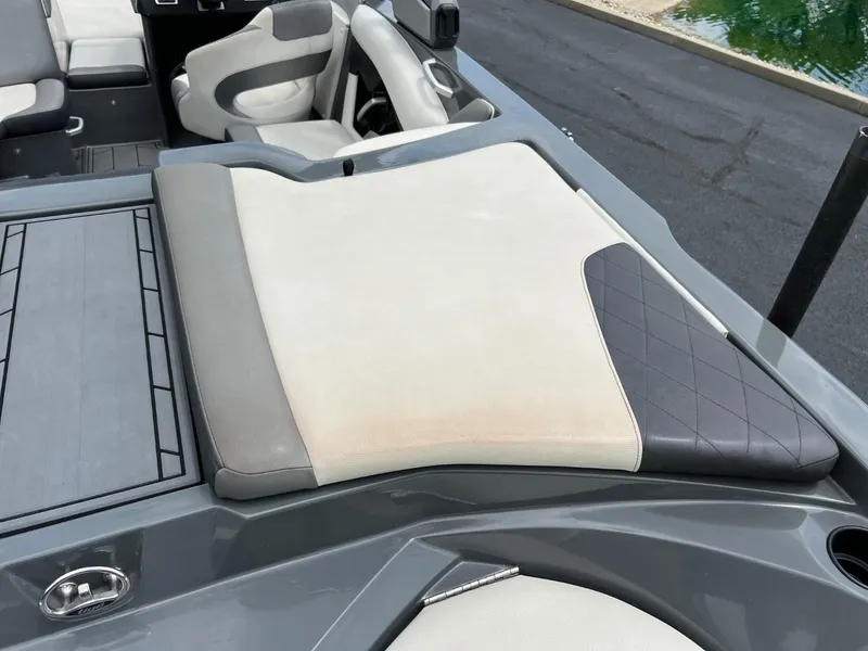 Slide: The Image of 2017 Tigé R21 boat interior with cushioned seating and sleek design. - 14