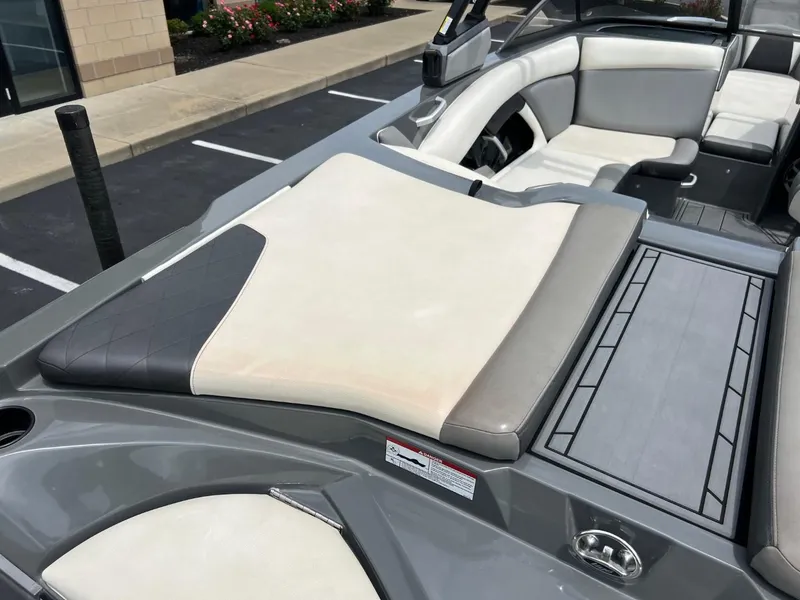Slide: The Image of 2017 Tigé R21 boat interior with gray and white seating. - 15
