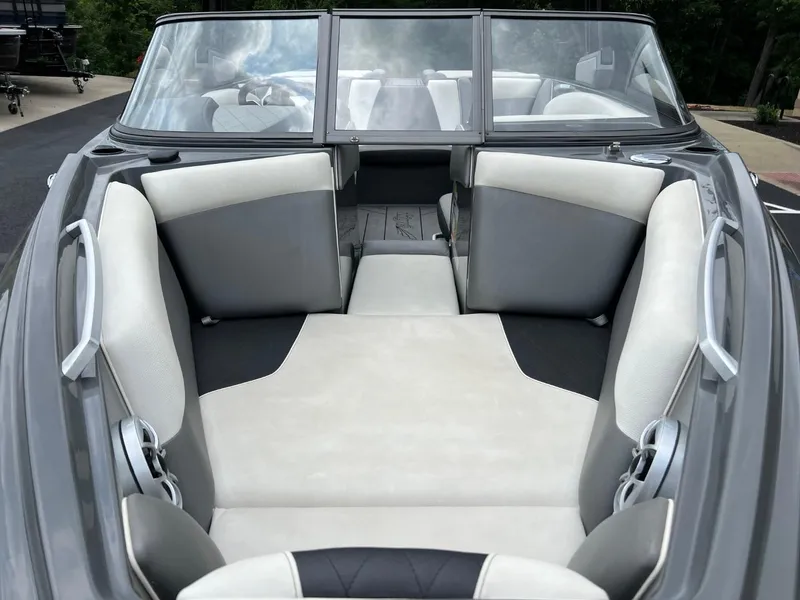 Slide: The Image of 2017 Tigé R21 boat interior with gray and white seating. - 7